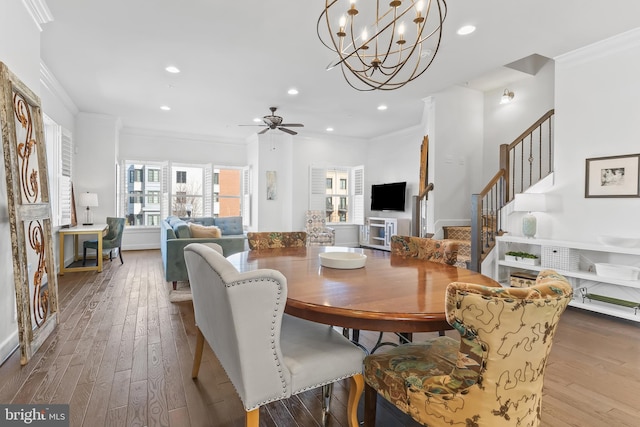 dining space with recessed lighting, crown molding, stairway, and hardwood / wood-style floors