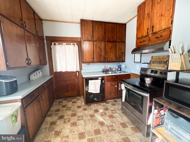 kitchen featuring stainless steel appliances, light countertops, a sink, and under cabinet range hood