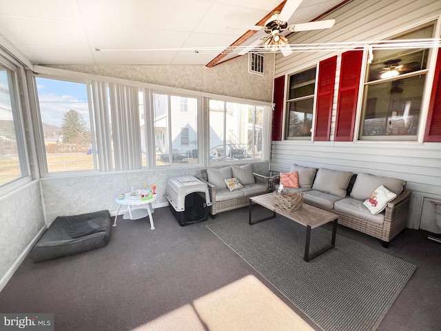 sunroom featuring lofted ceiling, plenty of natural light, visible vents, and a ceiling fan