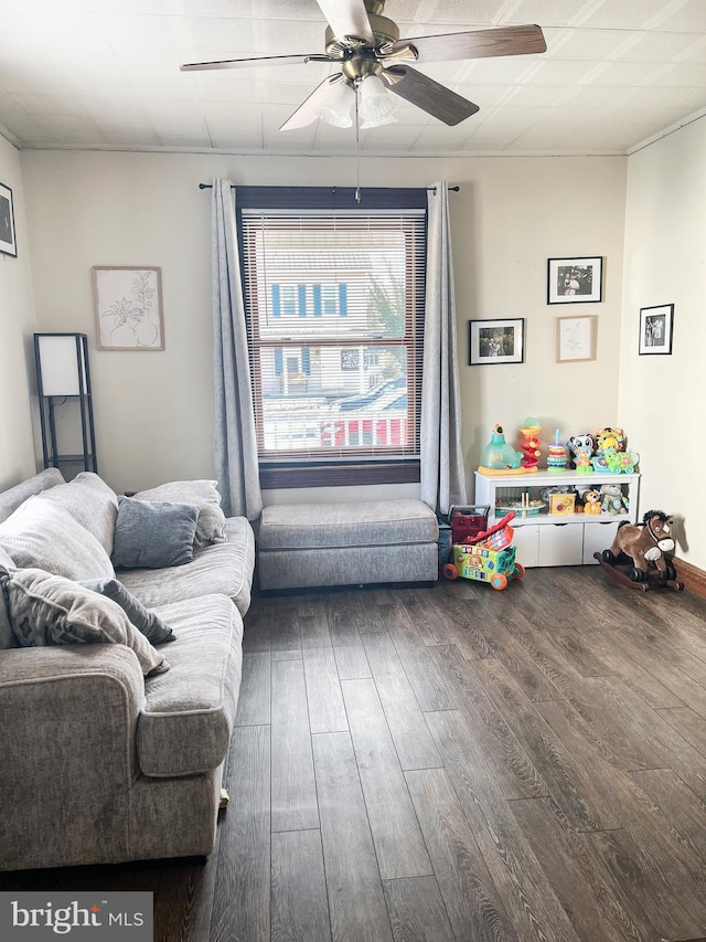 living room with ceiling fan and dark wood-style flooring