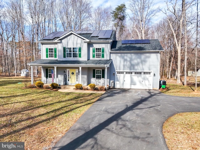 view of front facade featuring aphalt driveway, a shingled roof, covered porch, a garage, and a front lawn