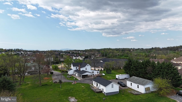 birds eye view of property with a residential view