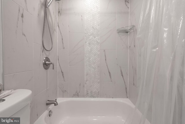 full bathroom with toilet and shower / bath combo with shower curtain