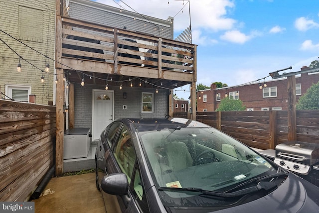 view of parking with fence