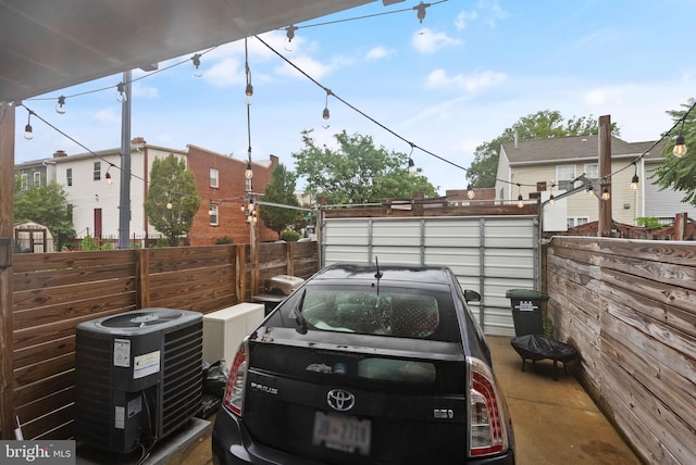 view of parking / parking lot with fence