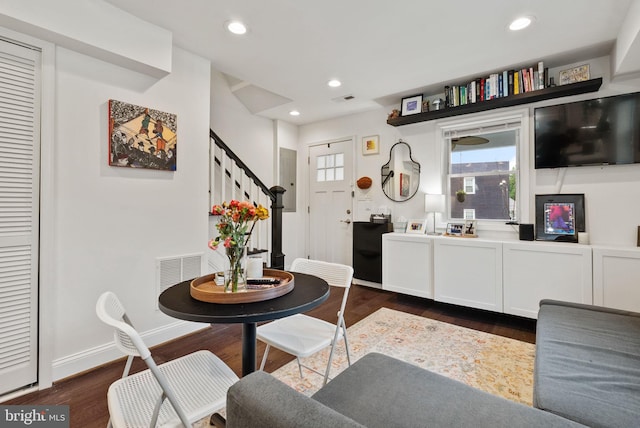 dining space featuring recessed lighting, dark wood-type flooring, visible vents, baseboards, and stairway