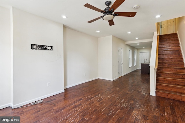 unfurnished living room with baseboards, stairway, hardwood / wood-style flooring, and recessed lighting