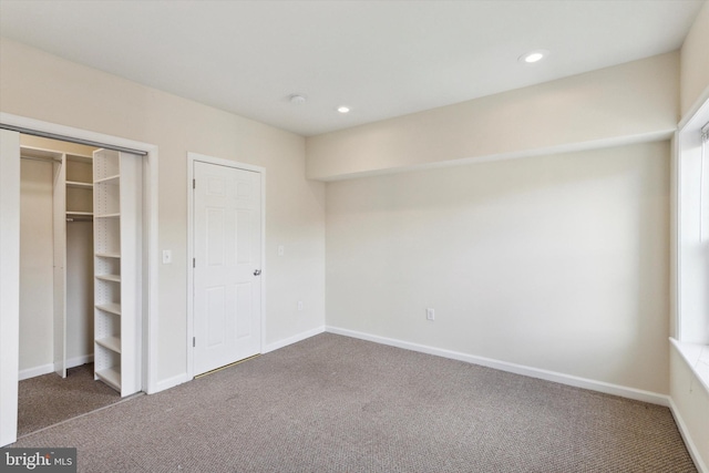 unfurnished bedroom with carpet floors, baseboards, and recessed lighting