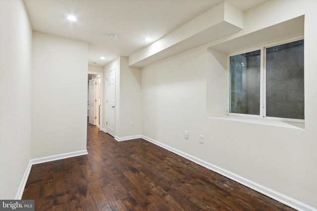 basement with recessed lighting, wood-type flooring, and baseboards