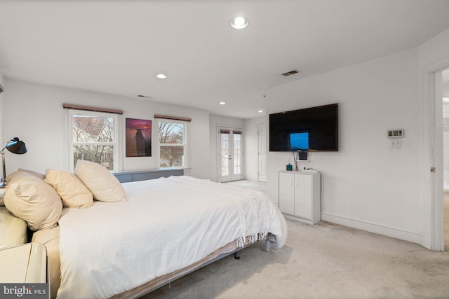 bedroom featuring multiple windows, recessed lighting, visible vents, and light colored carpet