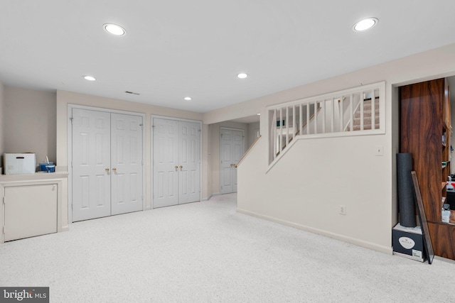 basement with baseboards, stairway, carpet, and recessed lighting