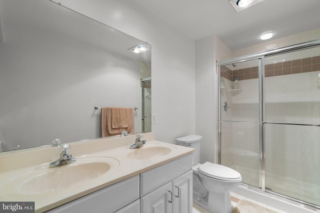 bathroom with a shower stall and a sink