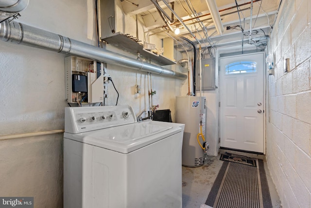 laundry area featuring concrete block wall, laundry area, electric panel, washer / clothes dryer, and gas water heater