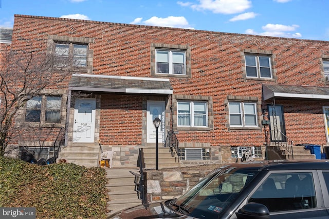 multi unit property with entry steps and brick siding