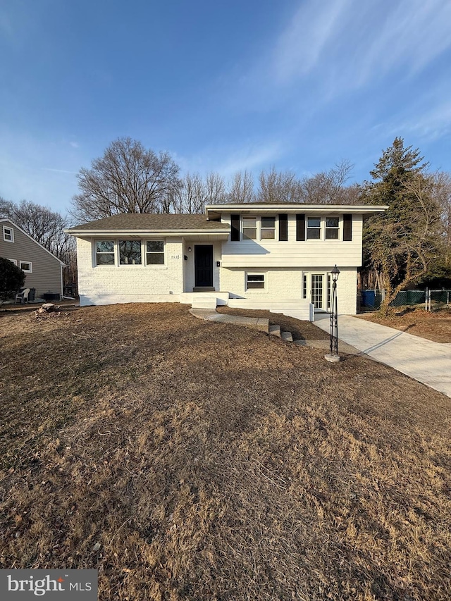 split level home with concrete driveway