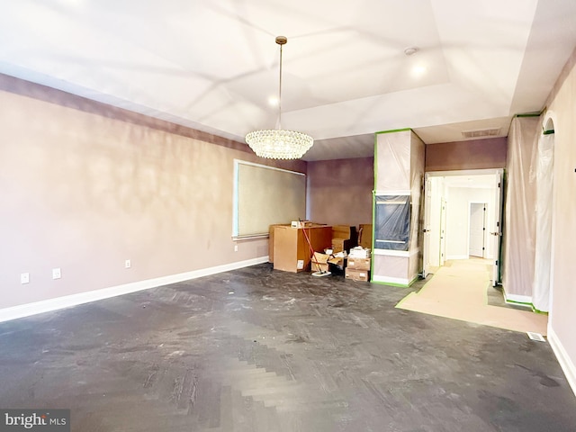 interior space featuring concrete flooring, visible vents, and baseboards