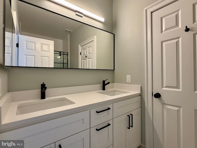 bathroom with double vanity and a sink