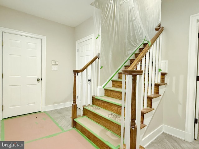 staircase with baseboards