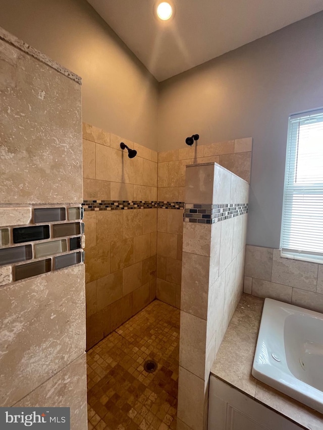 full bathroom featuring a walk in shower and a bath
