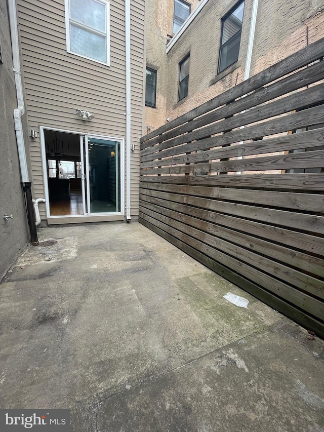 view of patio / terrace featuring fence