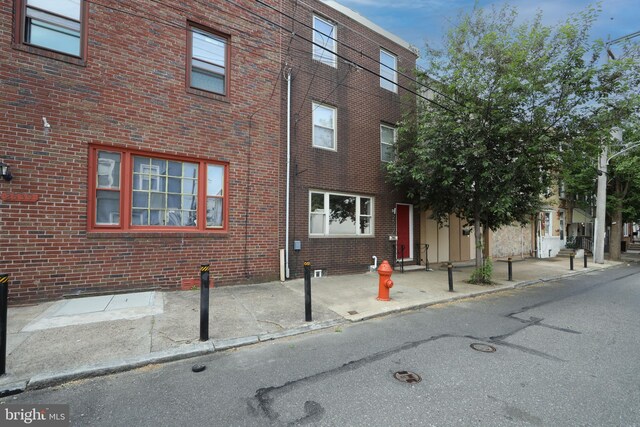 exterior space with brick siding