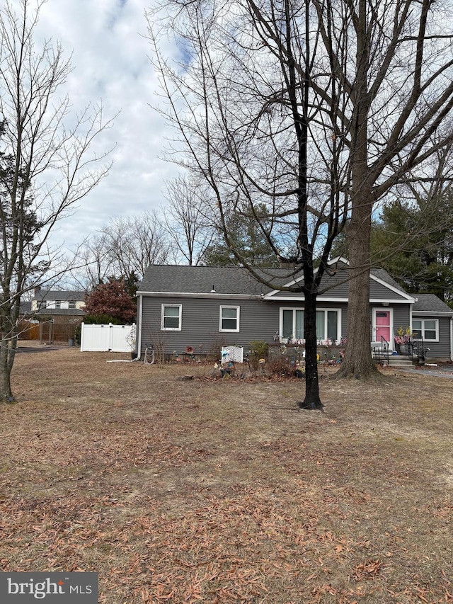 single story home with fence