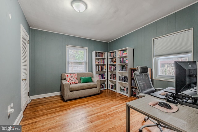 office area with wood finished floors and baseboards