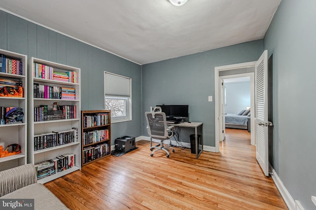 office area with wood finished floors and baseboards