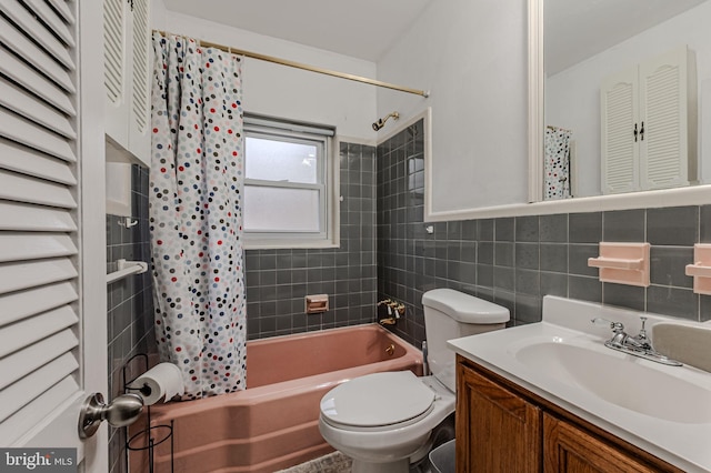 bathroom with toilet, shower / bath combination with curtain, tile walls, and vanity