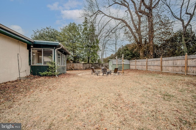 view of yard with a fenced backyard and an outdoor structure