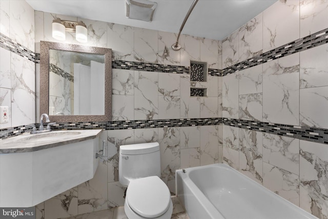 bathroom with bathtub / shower combination, vanity, toilet, and stone wall