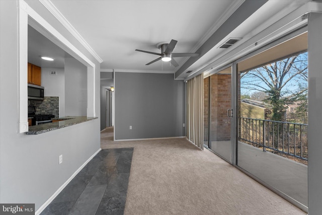 interior space featuring carpet floors, crown molding, a fireplace, visible vents, and ceiling fan