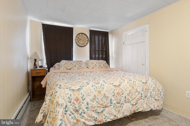 bedroom featuring carpet floors and baseboard heating