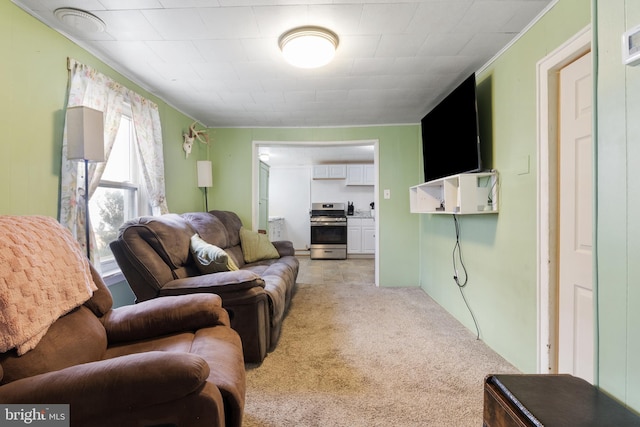 living area featuring light carpet