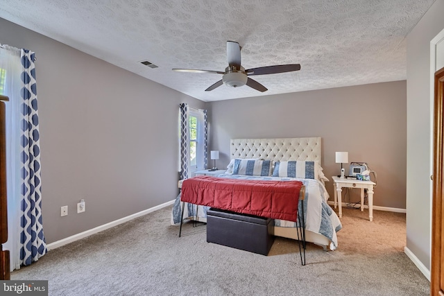 bedroom with carpet, visible vents, ceiling fan, and baseboards