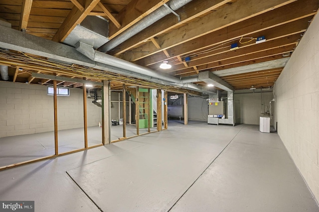 basement with washer / clothes dryer and heating unit