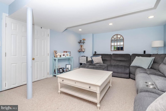 living room featuring light colored carpet and recessed lighting