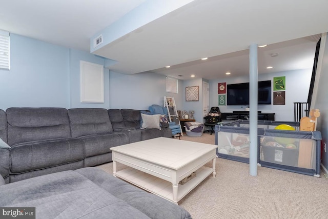 living room with light carpet, visible vents, and recessed lighting