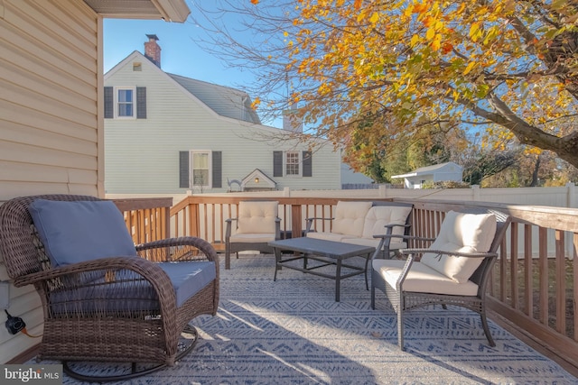 wooden deck featuring an outdoor hangout area