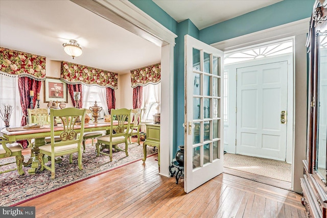 dining area featuring light wood-style floors