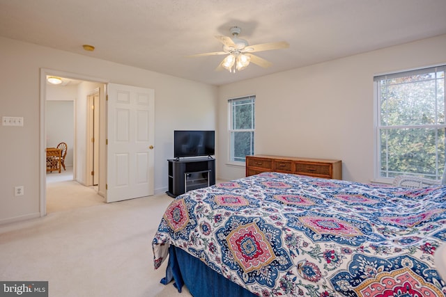 bedroom with carpet floors, a ceiling fan, and baseboards