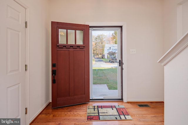 entrance foyer featuring baseboards and light wood-style floors