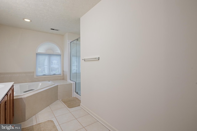 full bathroom with a stall shower, visible vents, tile patterned flooring, a textured ceiling, and vanity