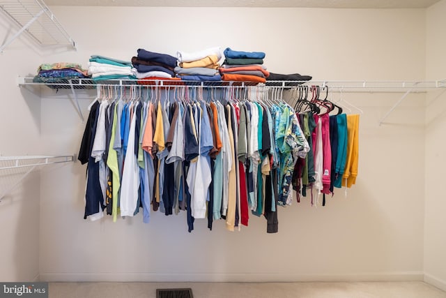 spacious closet featuring carpet and visible vents