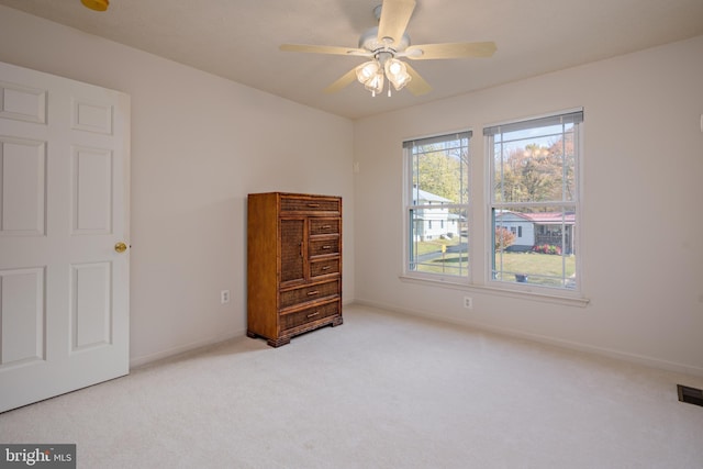 carpeted bedroom featuring ceiling fan and baseboards