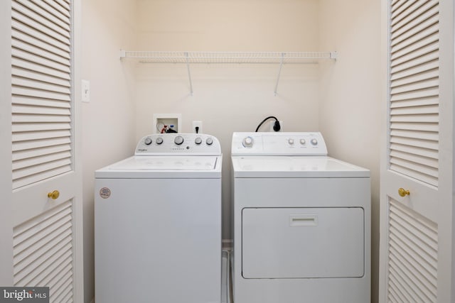 clothes washing area featuring laundry area and independent washer and dryer