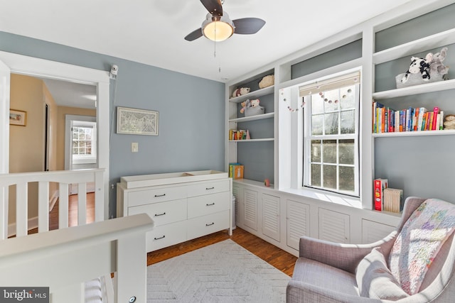 bedroom with light wood-type flooring and ceiling fan