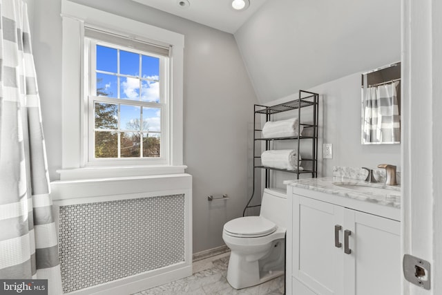 full bathroom featuring lofted ceiling, toilet, vanity, marble finish floor, and radiator