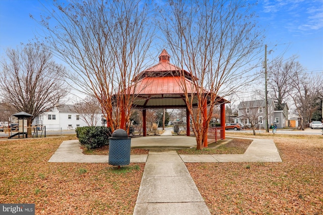 view of home's community with a gazebo, playground community, a residential view, and a lawn