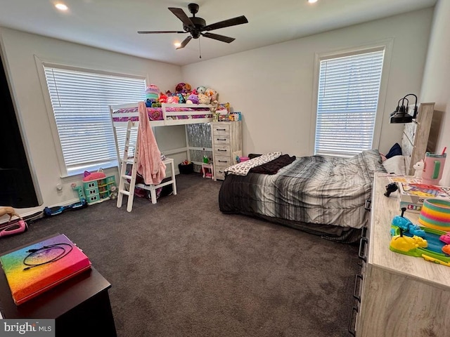 carpeted bedroom with multiple windows, a ceiling fan, and recessed lighting